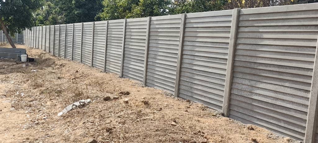 Long precast concrete boundary wall installed by Native Walls